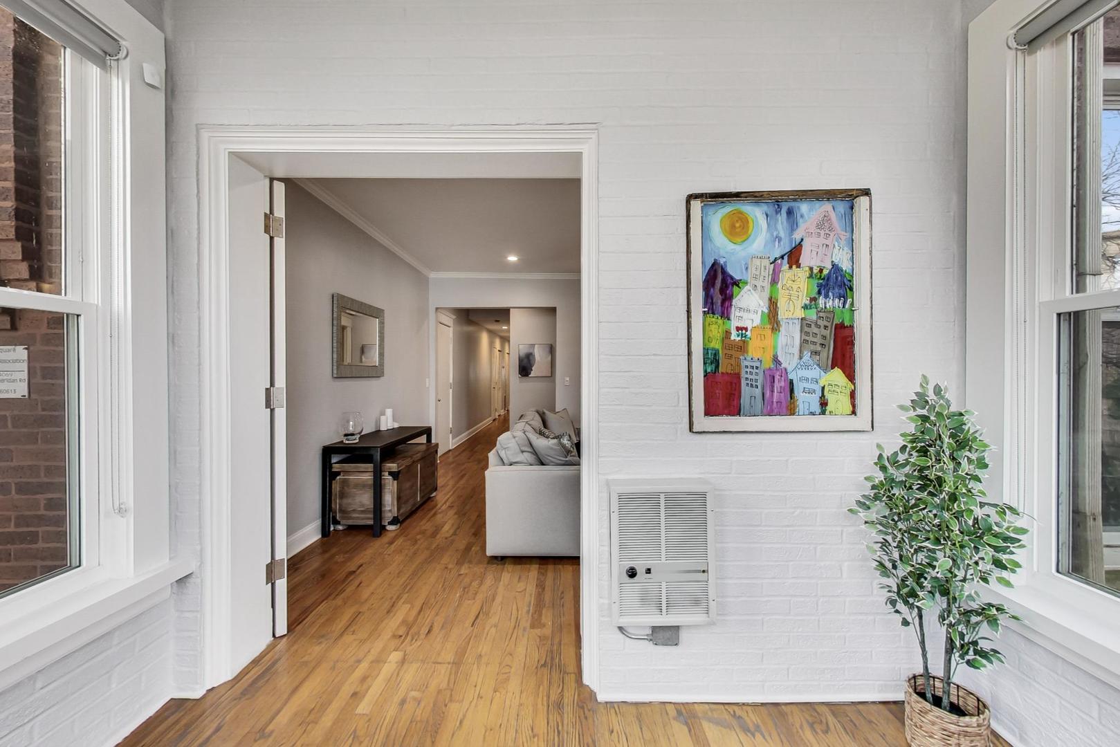 4342 North Sheridan Road, Unit 1N Chicago, IL 60613 - Photo 8 of 29 view of hall way with furniture and wooden floor