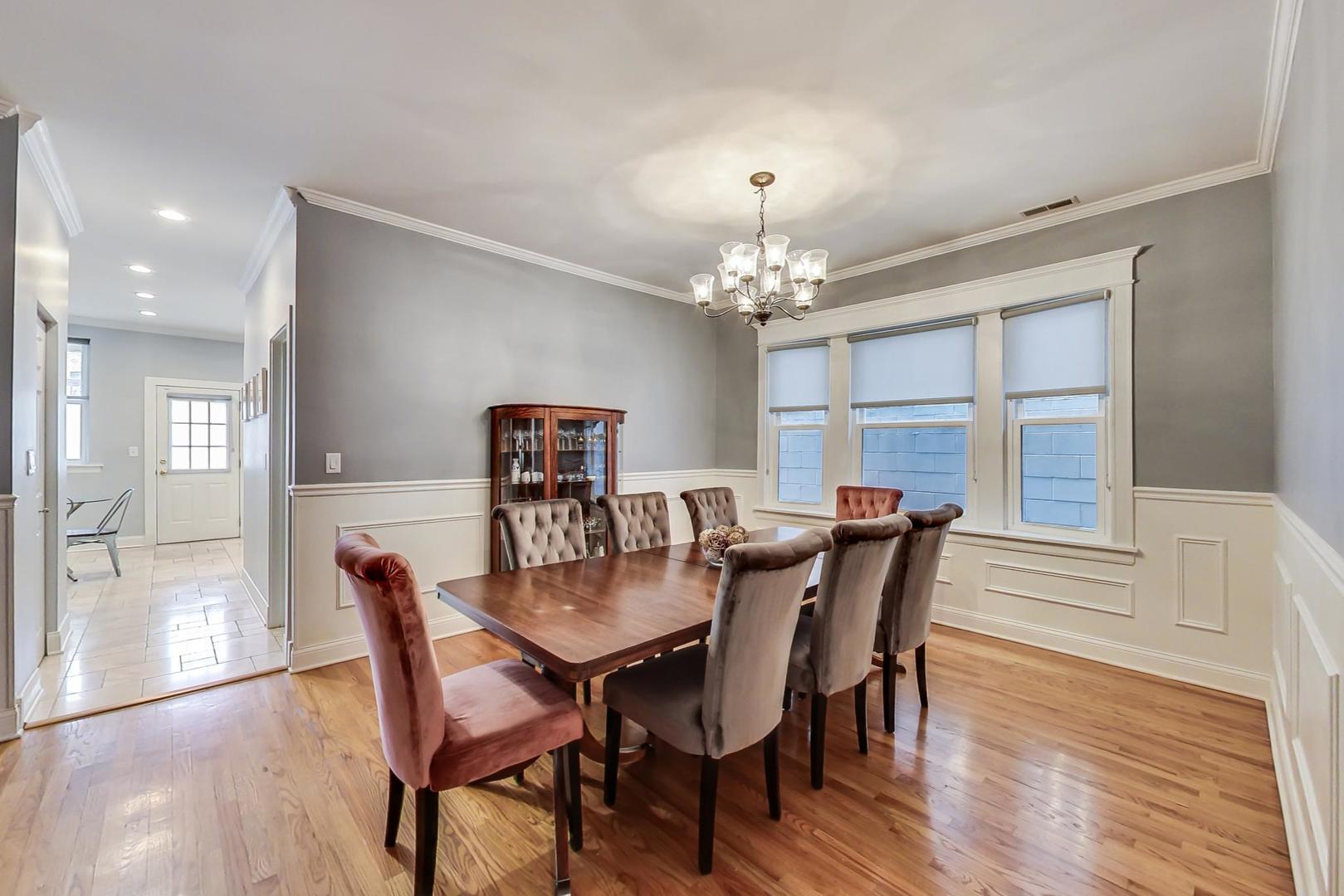 4342 North Sheridan Road, Unit 1N Chicago, IL 60613 - Photo 9 of 29 a view of a dining room with furniture and wooden floor
