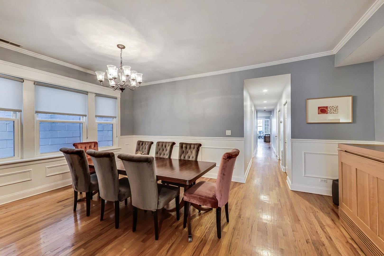 4342 North Sheridan Road, Unit 1N Chicago, IL 60613 - Photo 10 of 29 a view of a dining room with furniture and wooden floor