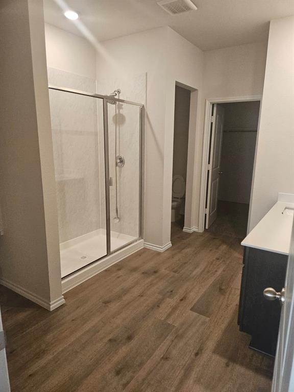 1520 Dilley Lane Forney, TX 75126 - Photo 9 of 26 a view of a room with wooden floor and cabinet