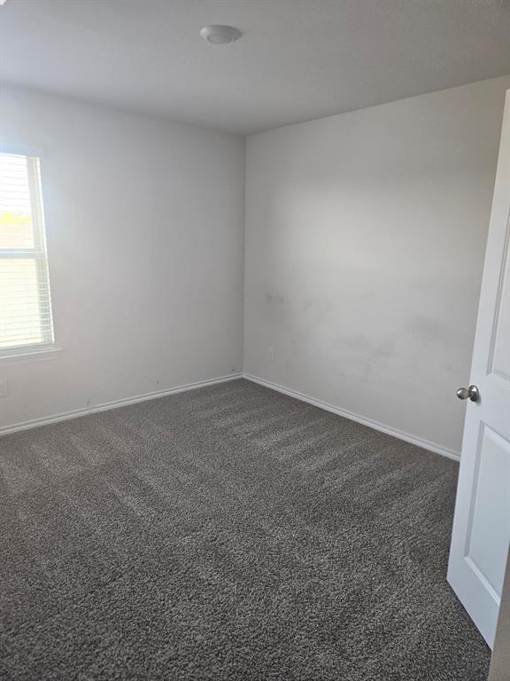 1520 Dilley Lane Forney, TX 75126 - Photo 14 of 26 an empty room with a window