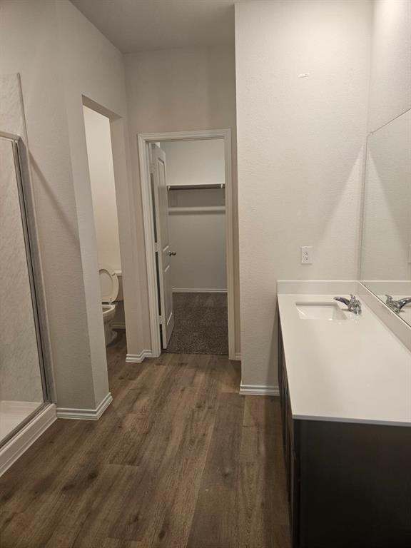 1520 Dilley Lane Forney, TX 75126 - Photo 7 of 26 a bathroom with a sink a toilet and a mirror