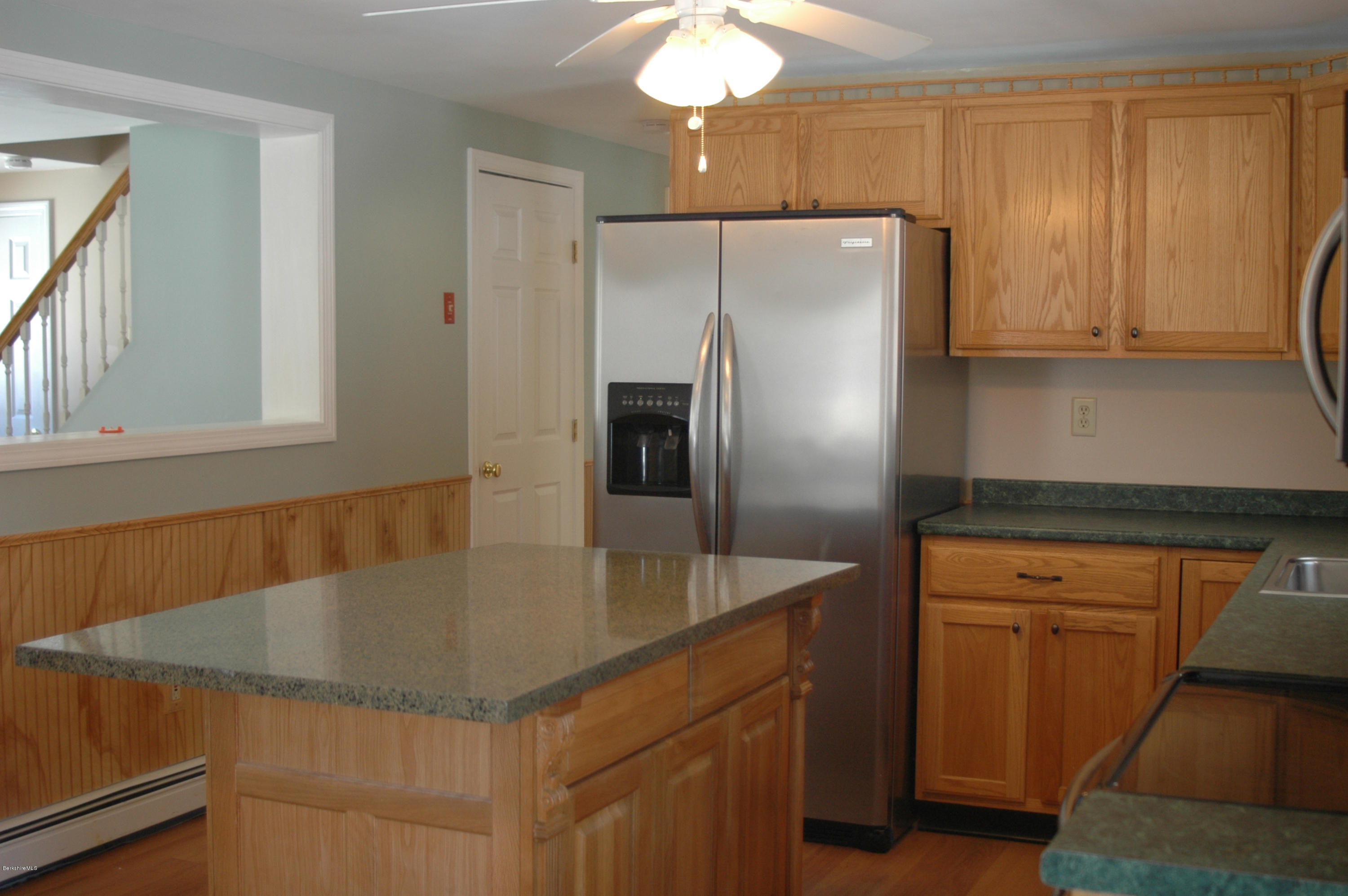 1201 River Road Clarksburg, MA 01247 - Photo 13 of 42 a kitchen with stainless steel appliances granite countertop a refrigerator a sink and a stove