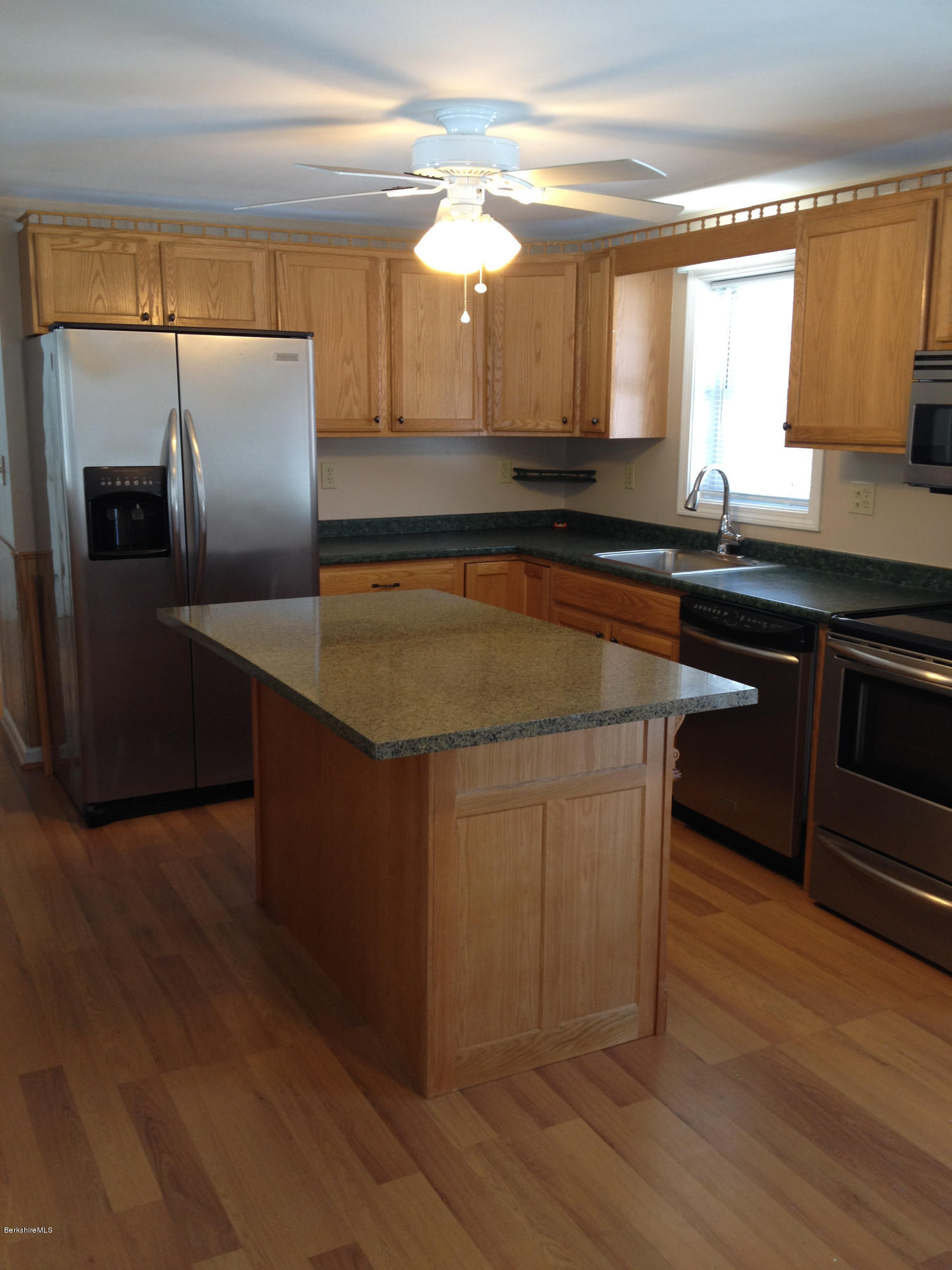 1201 River Road Clarksburg, MA 01247 - Photo 15 of 42 a kitchen with stainless steel appliances granite countertop a sink and a microwave