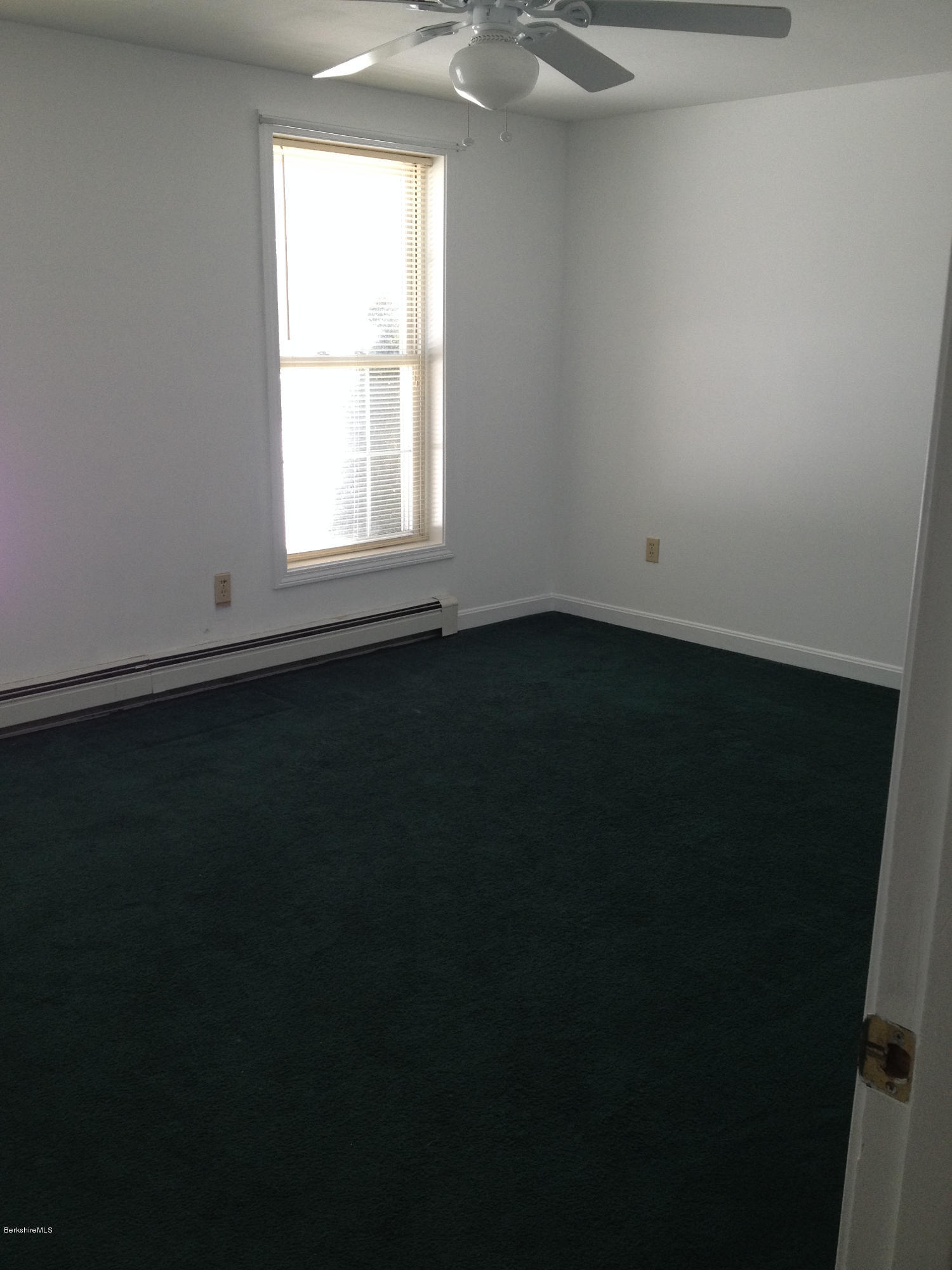 1201 River Road Clarksburg, MA 01247 - Photo 24 of 42 a view of an empty room with wooden floor and a window