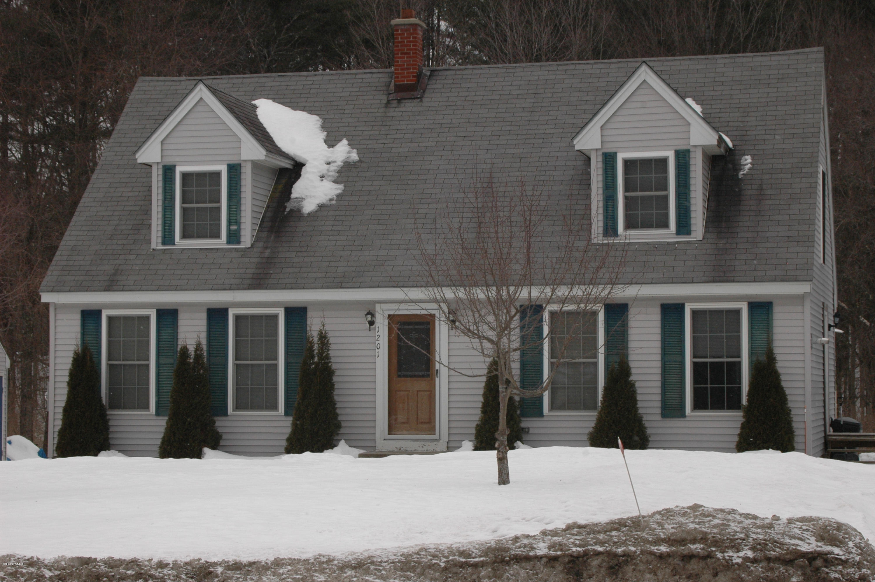 1201 River Road Clarksburg, MA 01247 - Photo 4 of 42 a view of a brick house with large windows