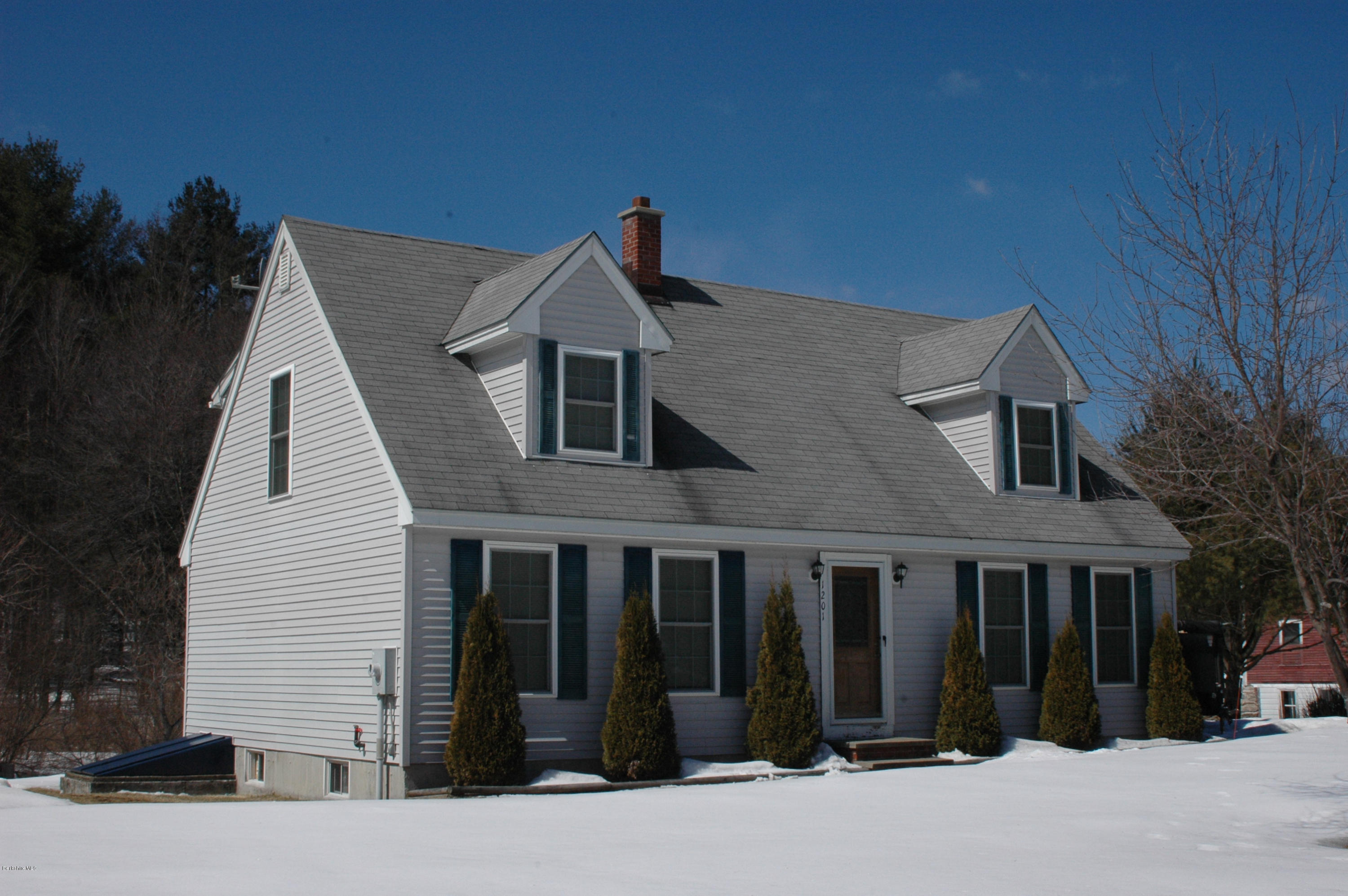 1201 River Road Clarksburg, MA 01247 - Photo 5 of 42 a front view of a house with a yard