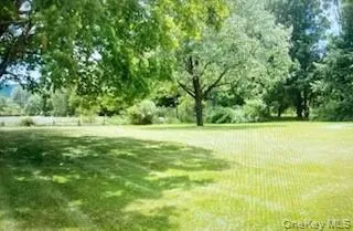 a view of outdoor space with deck and yard