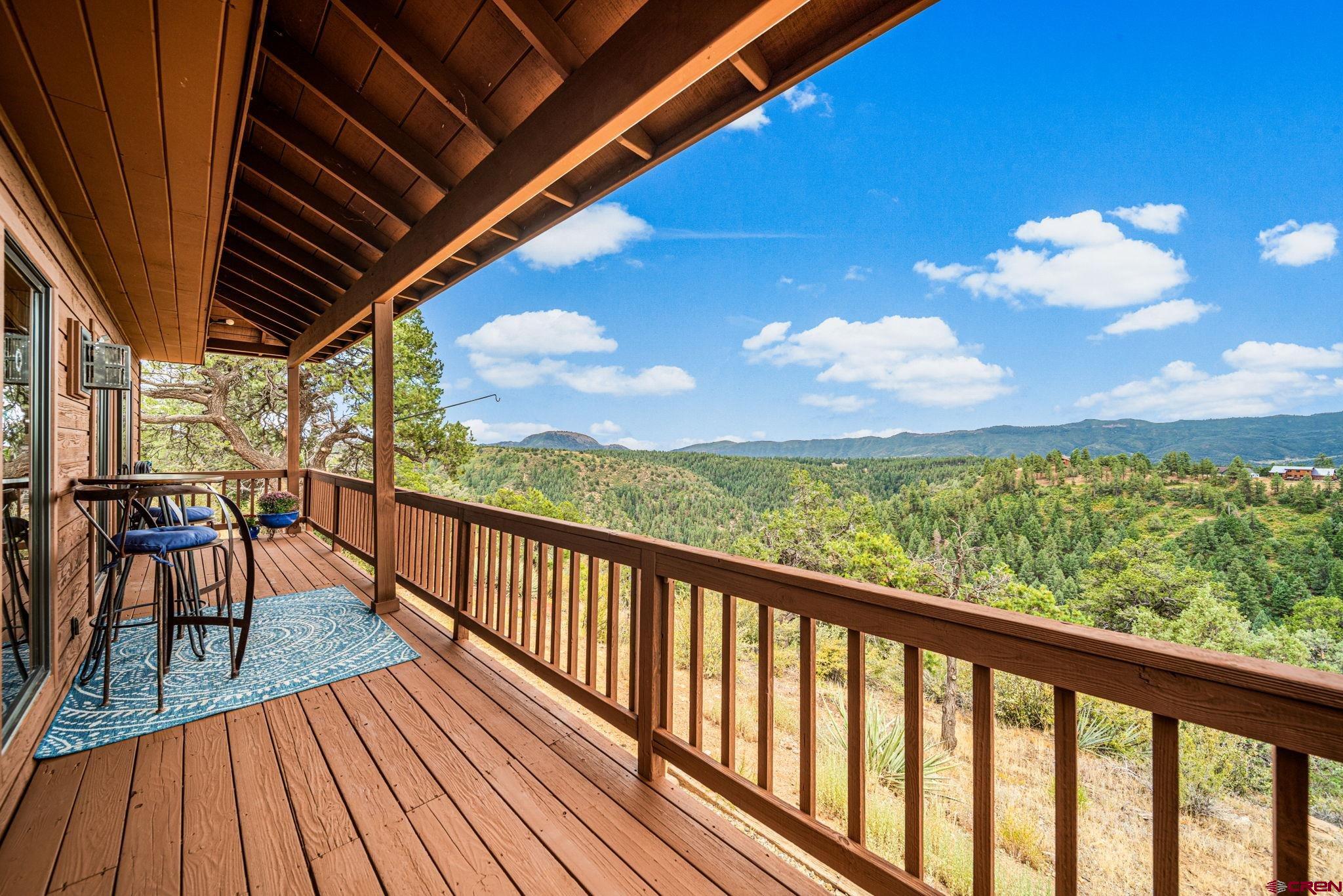 310 Far View Road Durango, CO 81303 - Photo 13 of 35 a view of a balcony with wooden floor