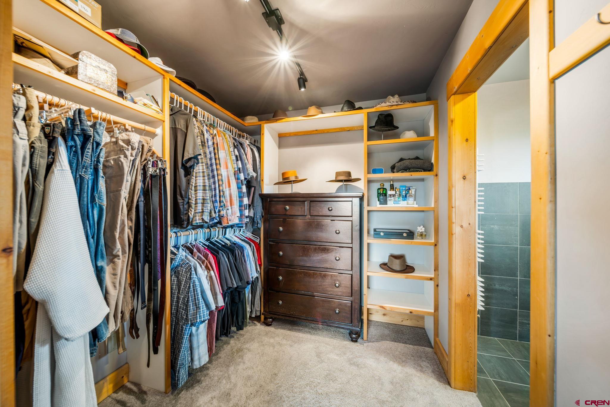 310 Far View Road Durango, CO 81303 - Photo 18 of 35 a view of walk in closet with clothes and shoes