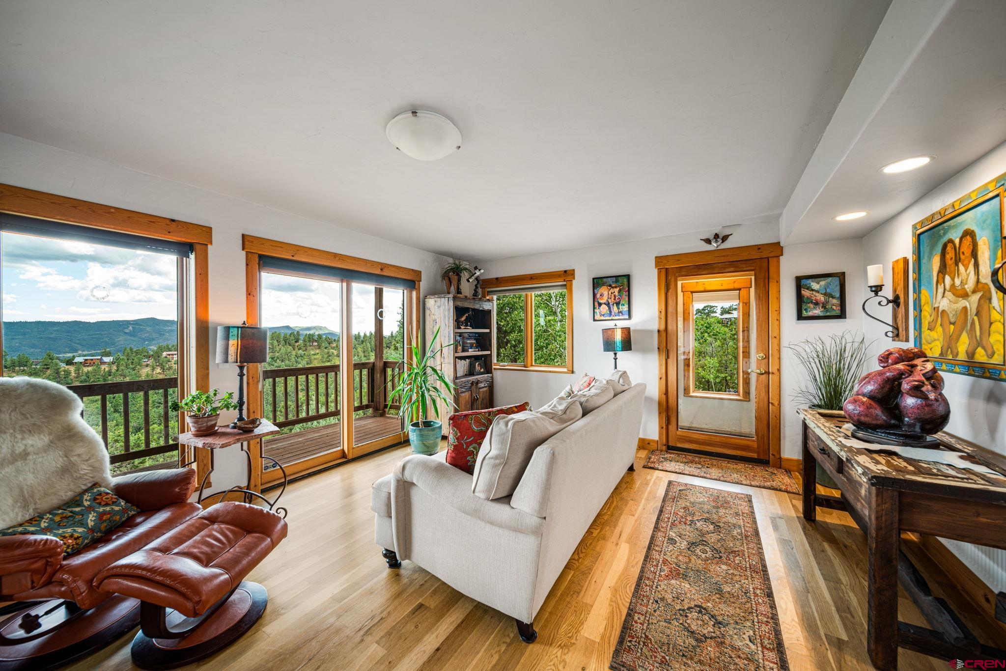 310 Far View Road Durango, CO 81303 - Photo 6 of 35 a living room with furniture and a floor to ceiling window