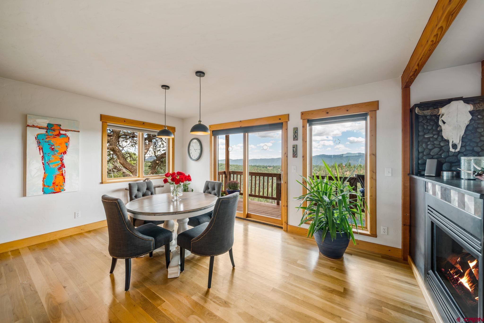 310 Far View Road Durango, CO 81303 - Photo 7 of 35 a view of a dining room with furniture window and wooden floor