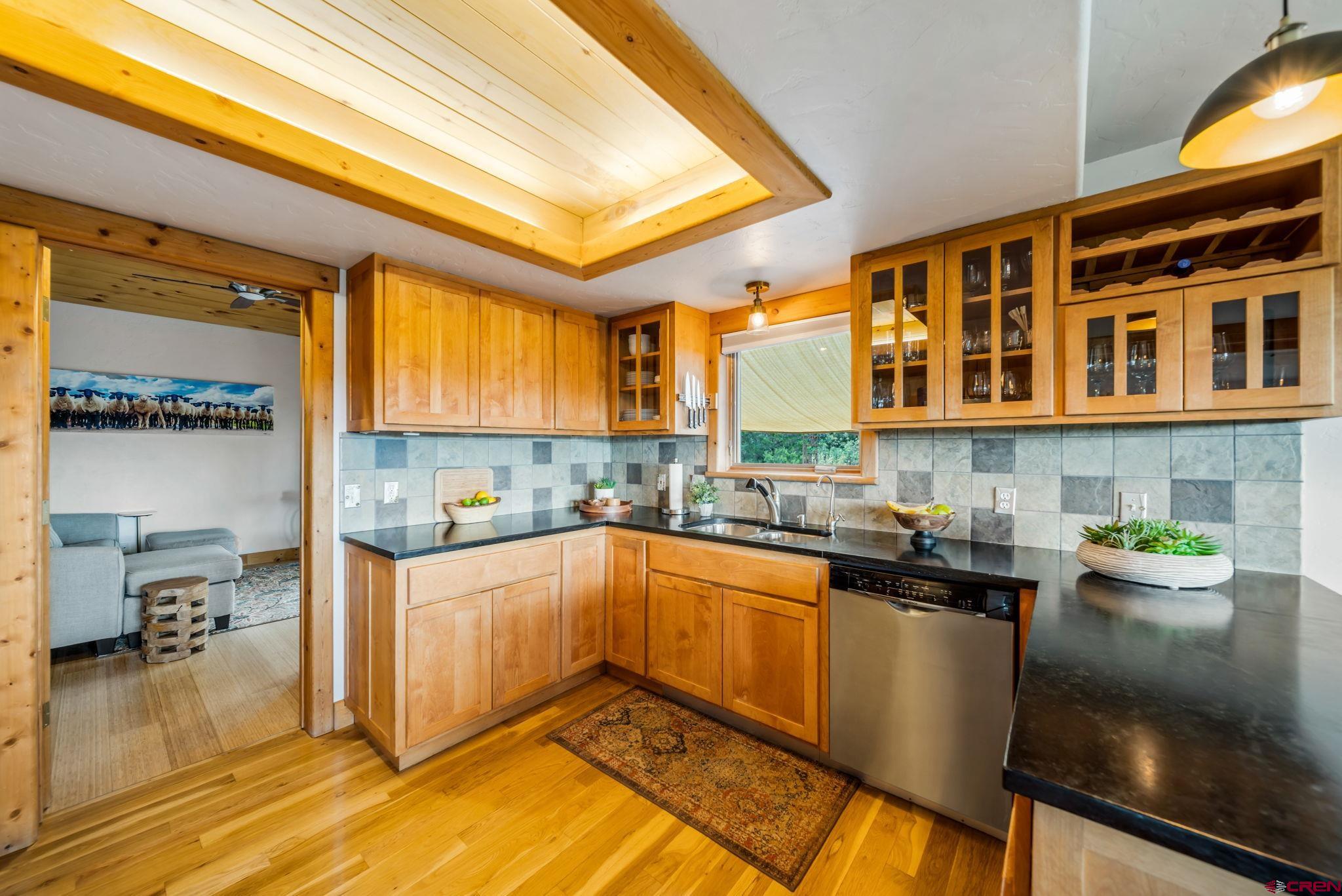 310 Far View Road Durango, CO 81303 - Photo 8 of 35 a kitchen with a sink and cabinets