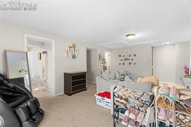 a bedroom with furniture and a closet