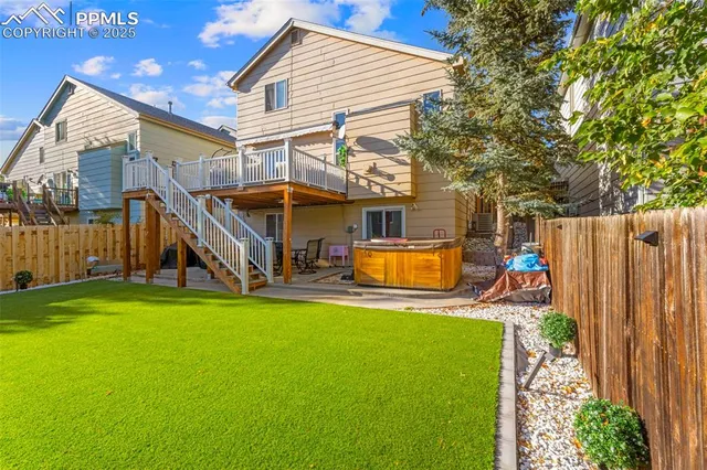 a view of a house with a back yard