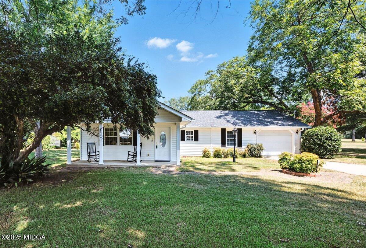 4175 Jones Road Macon, GA 31216 - Photo 2 of 40 a house view with a sitting space and garden