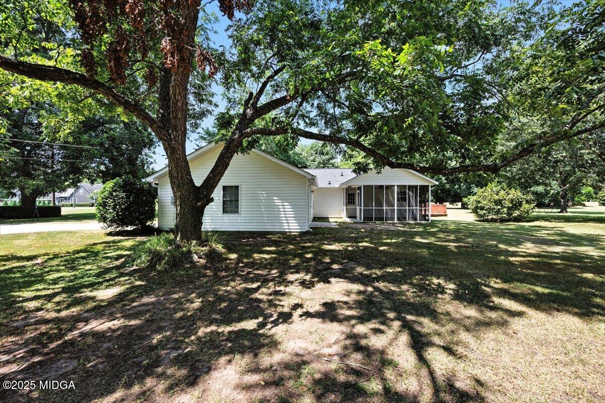 4175 Jones Road Macon, GA 31216 - Photo 29 of 40 a backyard of a house with lots of green space