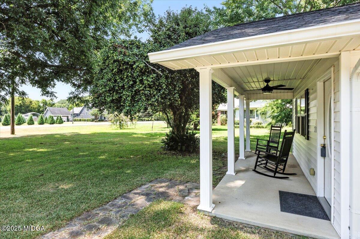 4175 Jones Road Macon, GA 31216 - Photo 3 of 40 a view of a patio with table and chairs and potted plants