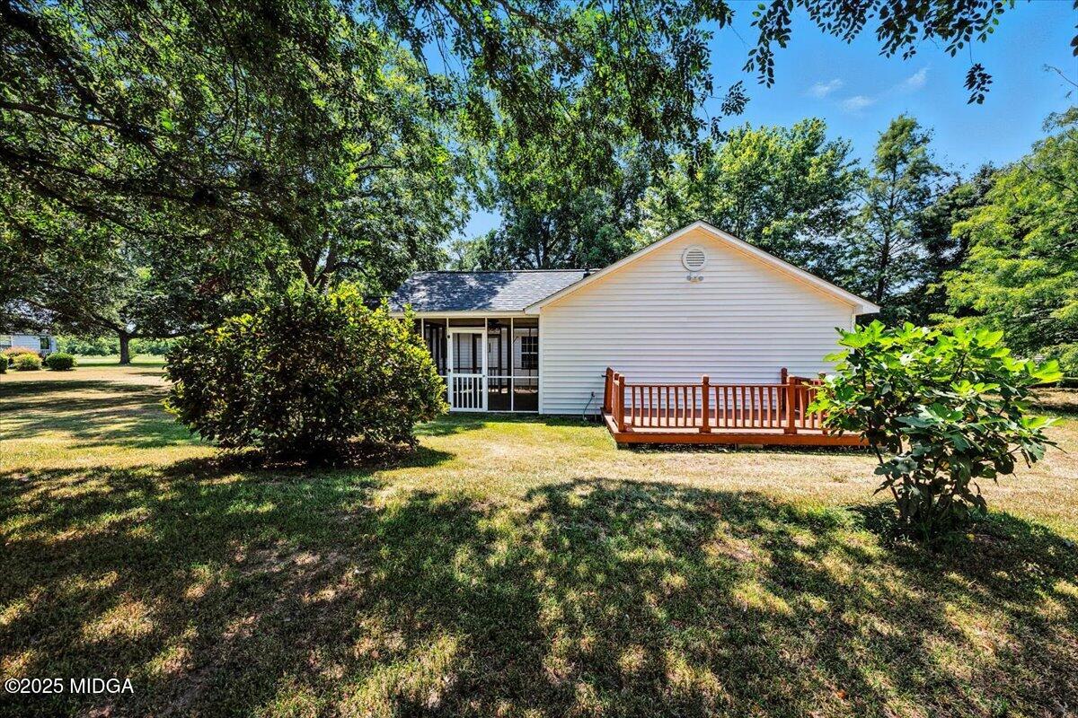 4175 Jones Road Macon, GA 31216 - Photo 36 of 40 a view of a house with a yard and garage