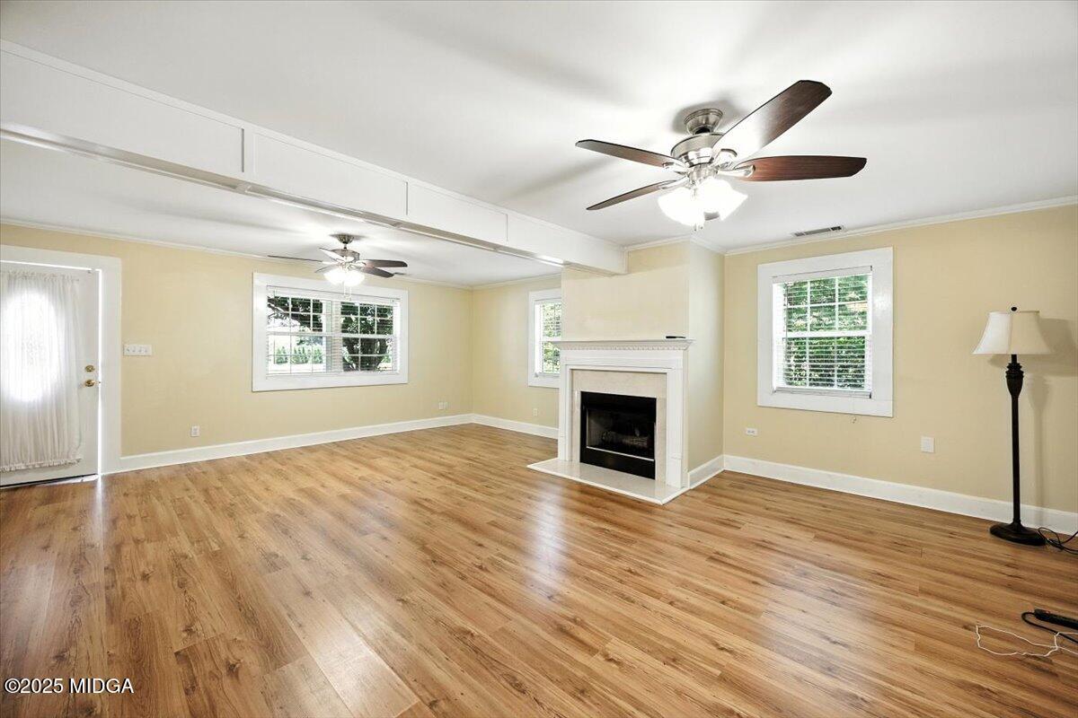 4175 Jones Road Macon, GA 31216 - Photo 5 of 40 a view of empty room with wooden floor and fan