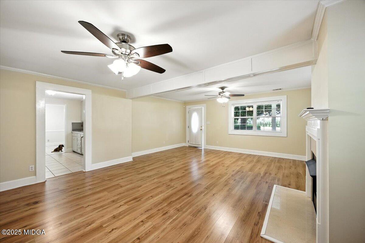 4175 Jones Road Macon, GA 31216 - Photo 6 of 40 a view of empty room with wooden floor and fan