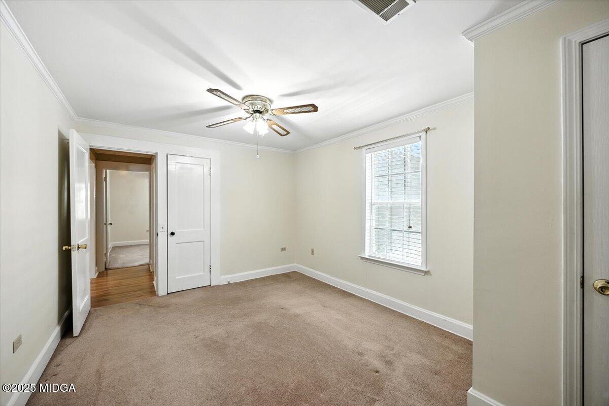 4175 Jones Road Macon, GA 31216 - Photo 8 of 40 an empty room with windows and fan