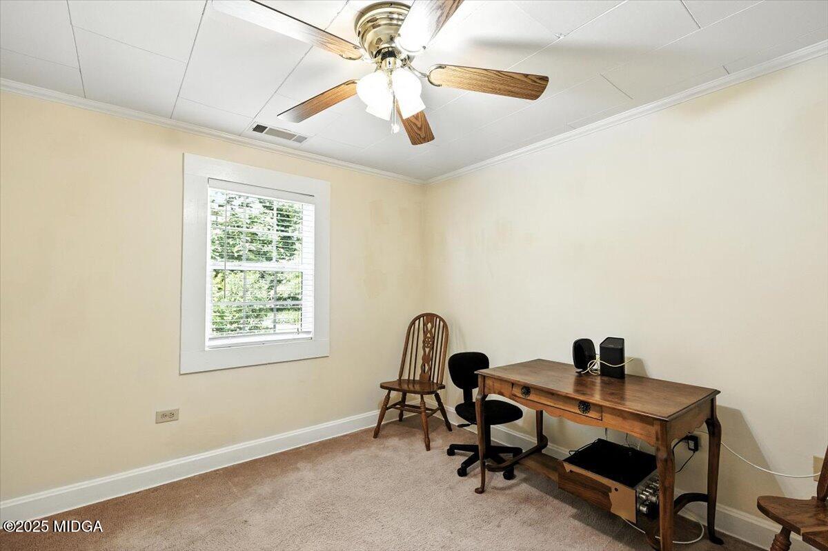 4175 Jones Road Macon, GA 31216 - Photo 9 of 40 a view of a workspace with furniture and a window