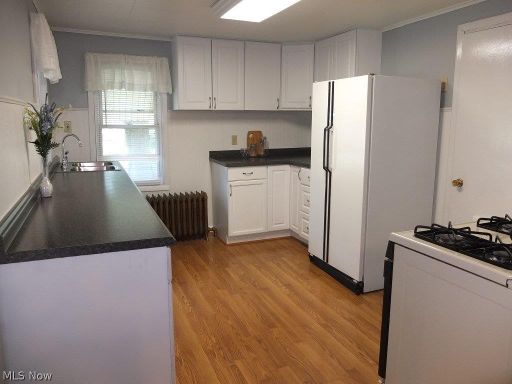 Kitchen with updated cabinets and countertops.