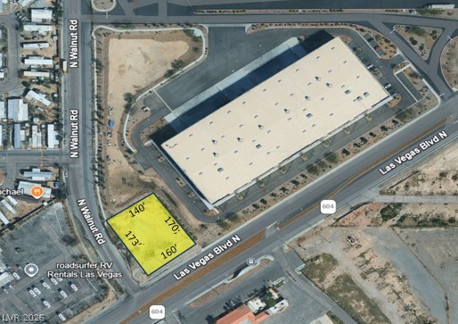 North Walnut Road Las Vegas, NV 89115 - Photo 5 of 5 Prime corner lot with extensive road frontage, ideal for high visibility commercial development.