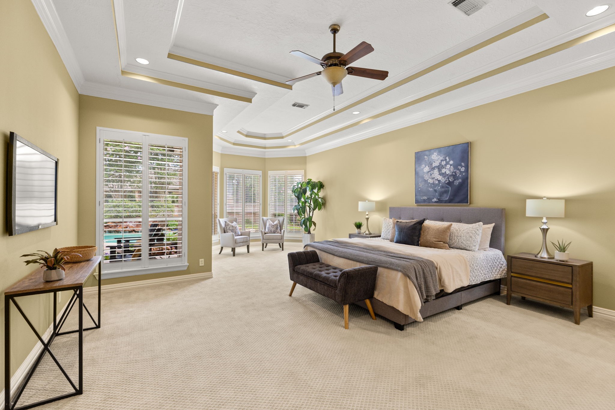6610 Radley Drive Spring, TX 77379 - Photo 21 of 50 Spacious primary suite with high tray ceilings and full view of your backyard oasis.