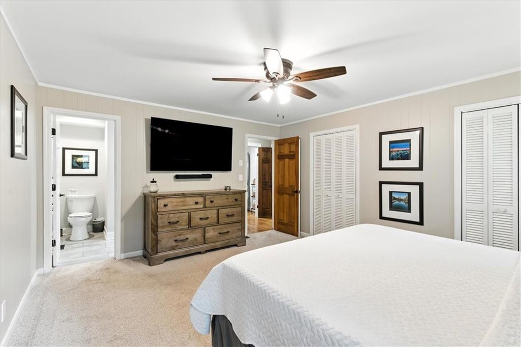 11 Brow Road Rome, GA 30165 - Photo 16 of 58 a bedroom with a bed and a flat screen tv