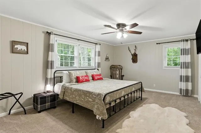 a living room with furniture a window and a fireplace