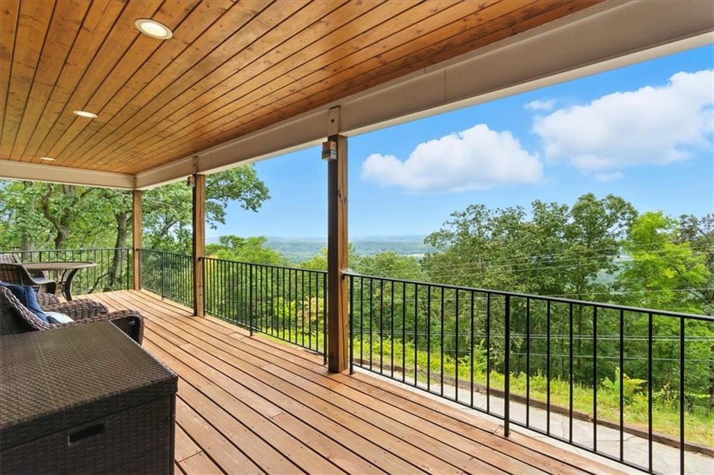 11 Brow Road Rome, GA 30165 - Photo 3 of 58 a view of a balcony with couches and wooden floor