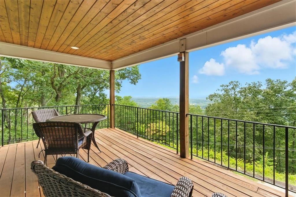 11 Brow Road Rome, GA 30165 - Photo 38 of 58 a balcony with furniture and wooden floor