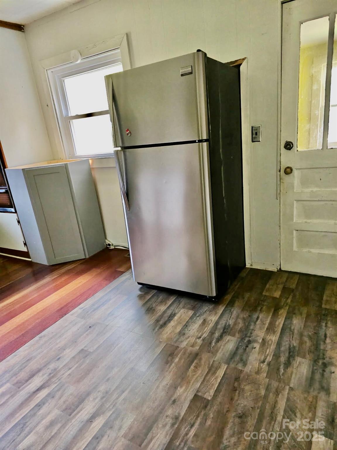 1851 Enon Road Valdese, NC 28690 - Photo 11 of 30 a view of a refrigerator in kitchen and an empty room