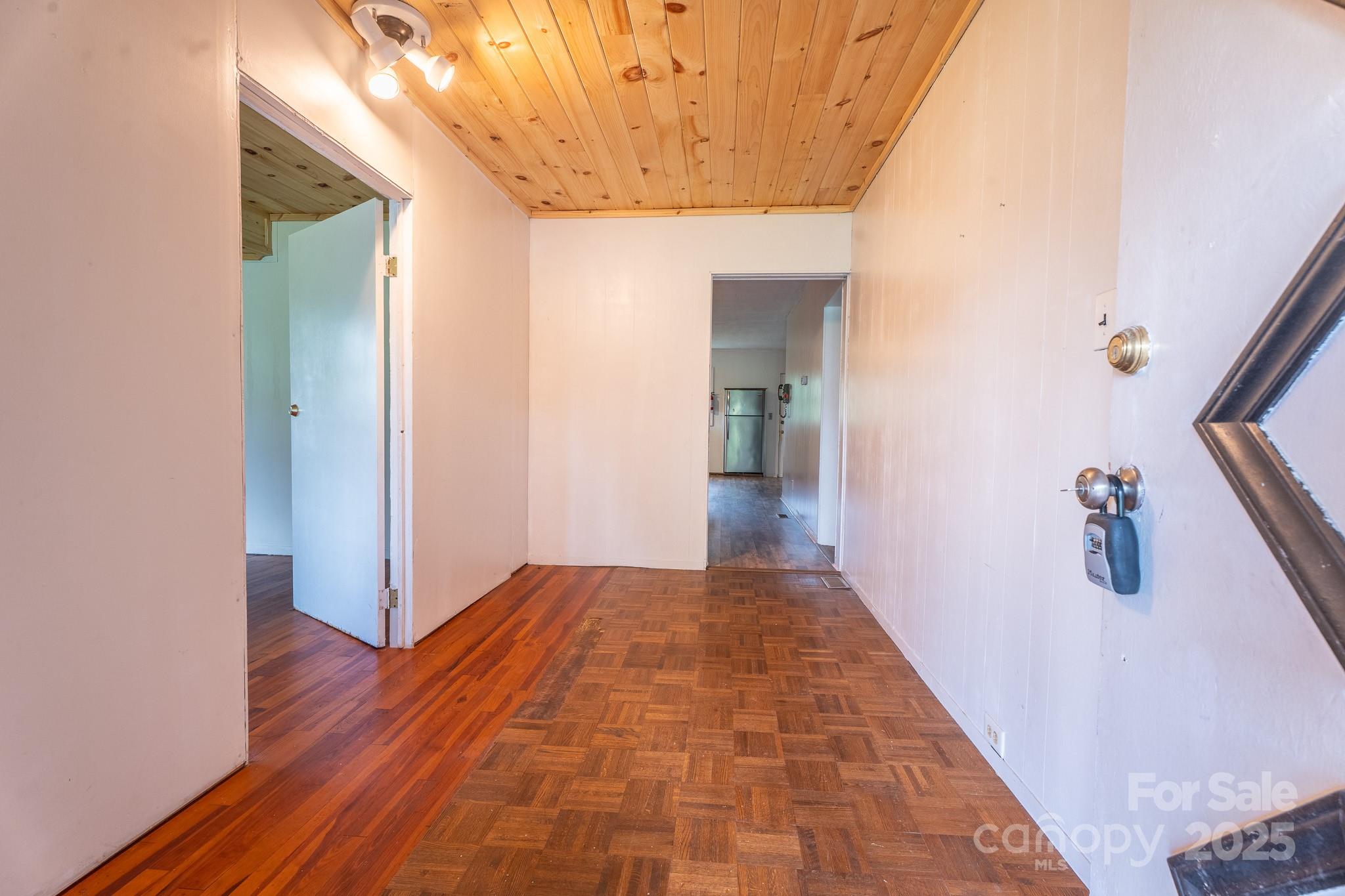 1851 Enon Road Valdese, NC 28690 - Photo 15 of 30 a view of a hallway with wooden floor and a bathroom