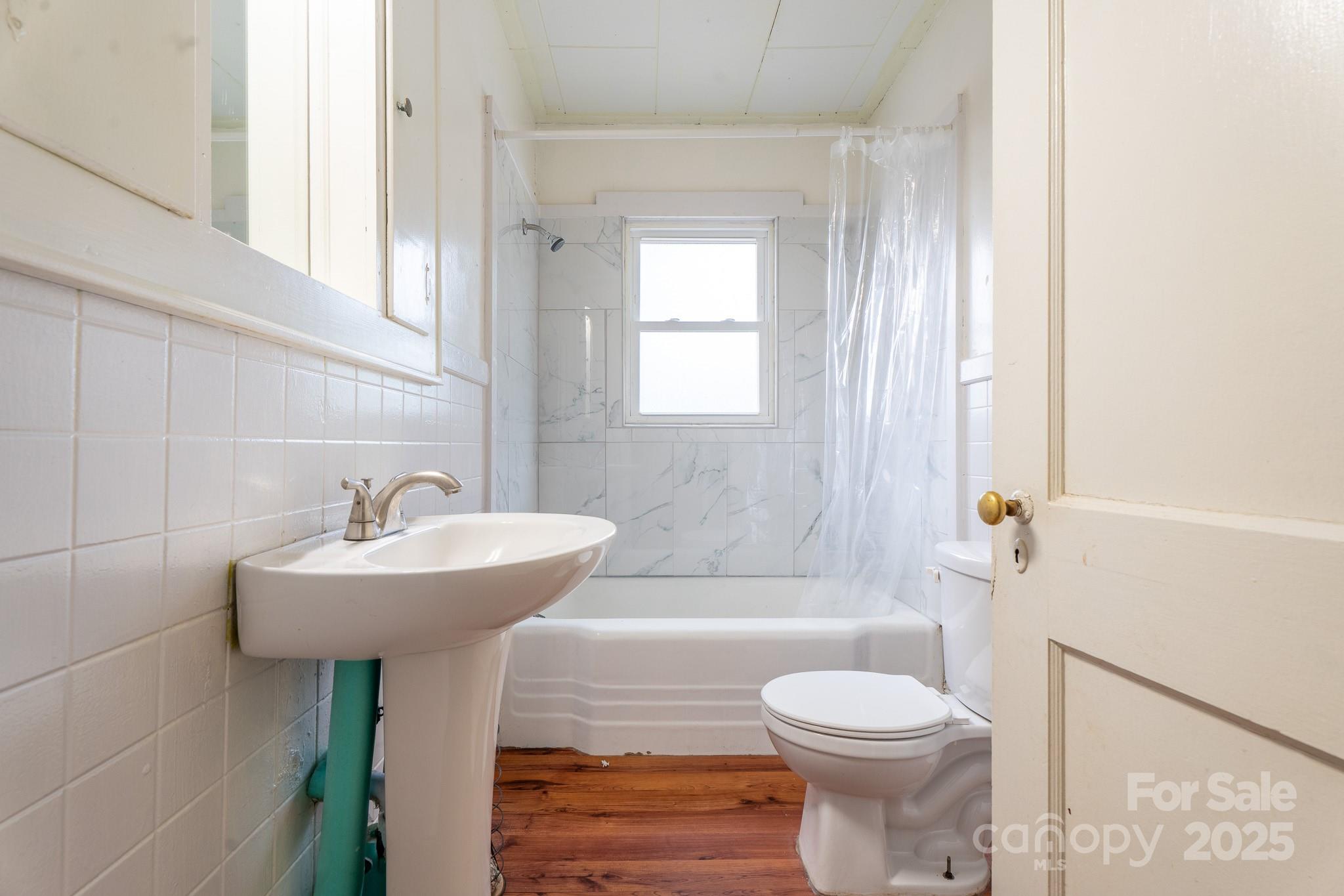 1851 Enon Road Valdese, NC 28690 - Photo 21 of 30 a bathroom with a sink toilet and shower