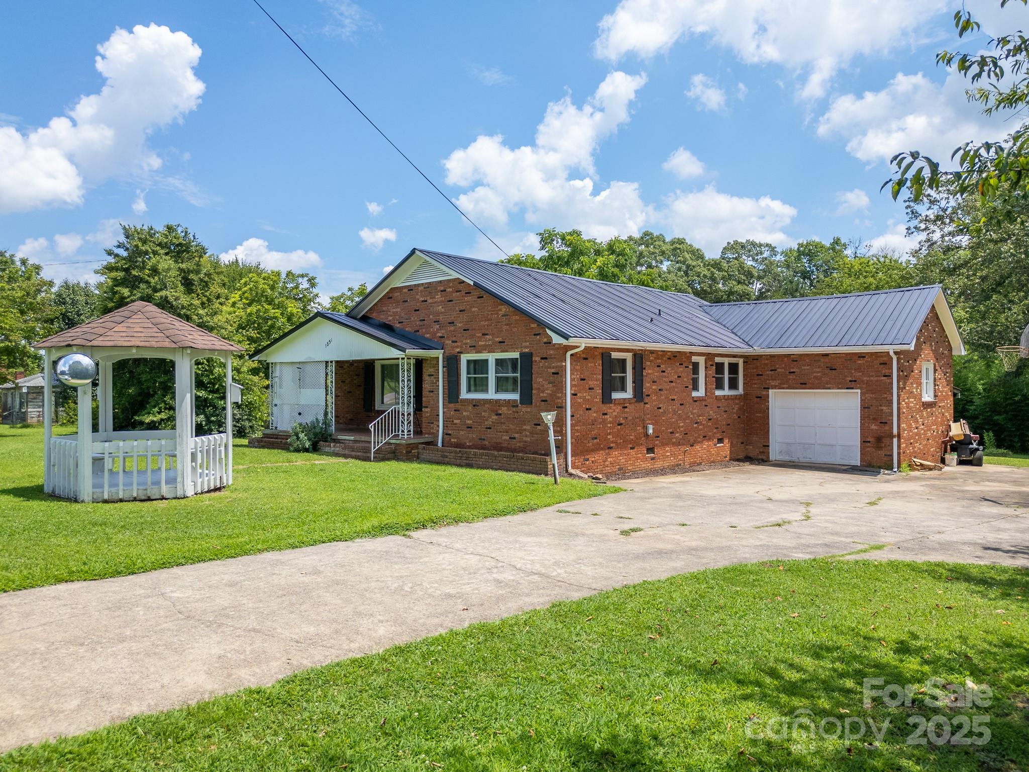 1851 Enon Road Valdese, NC 28690 - Photo 23 of 30 a front view of a house with garden