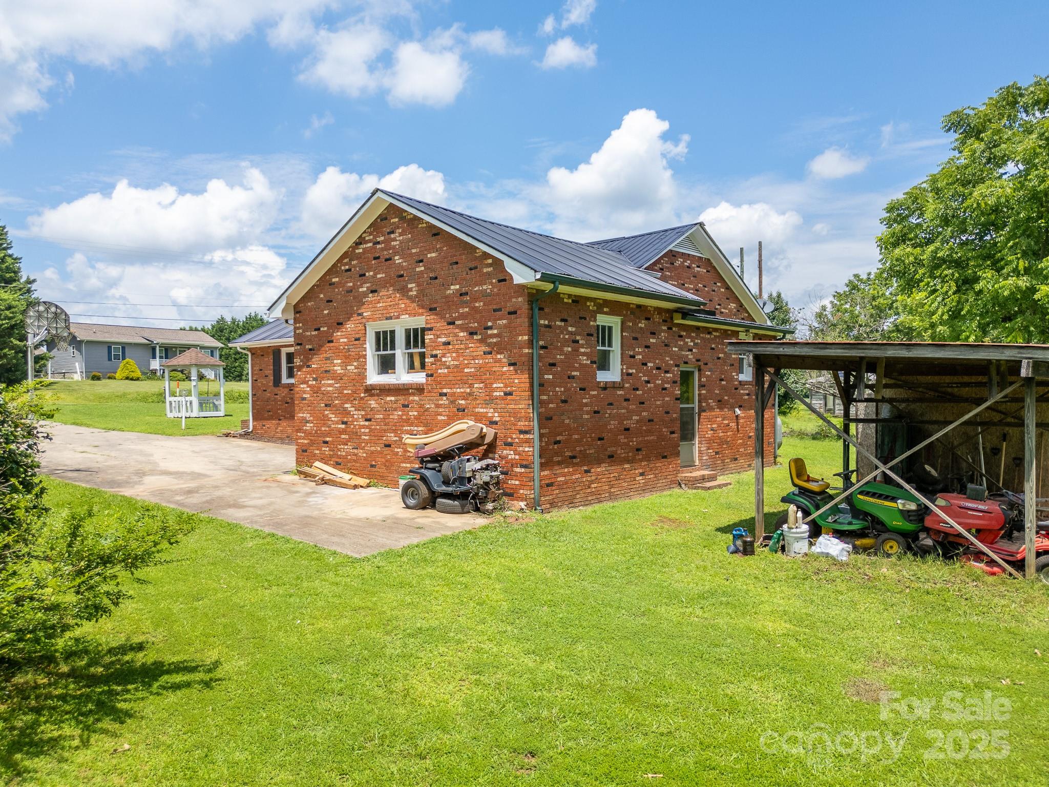 1851 Enon Road Valdese, NC 28690 - Photo 25 of 30 a view of backyard with a patio