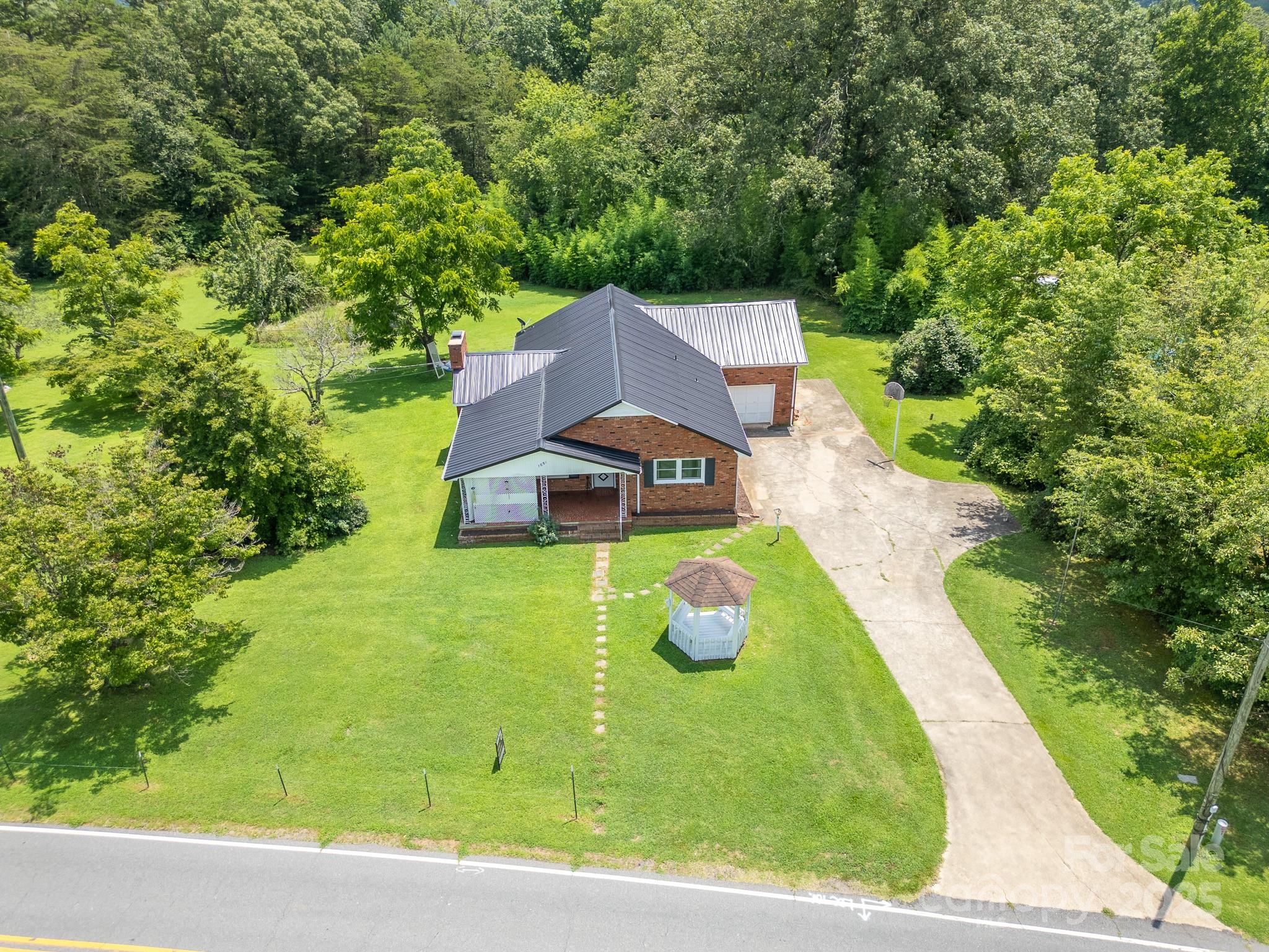 1851 Enon Road Valdese, NC 28690 - Photo 26 of 30 a view of a house with a yard