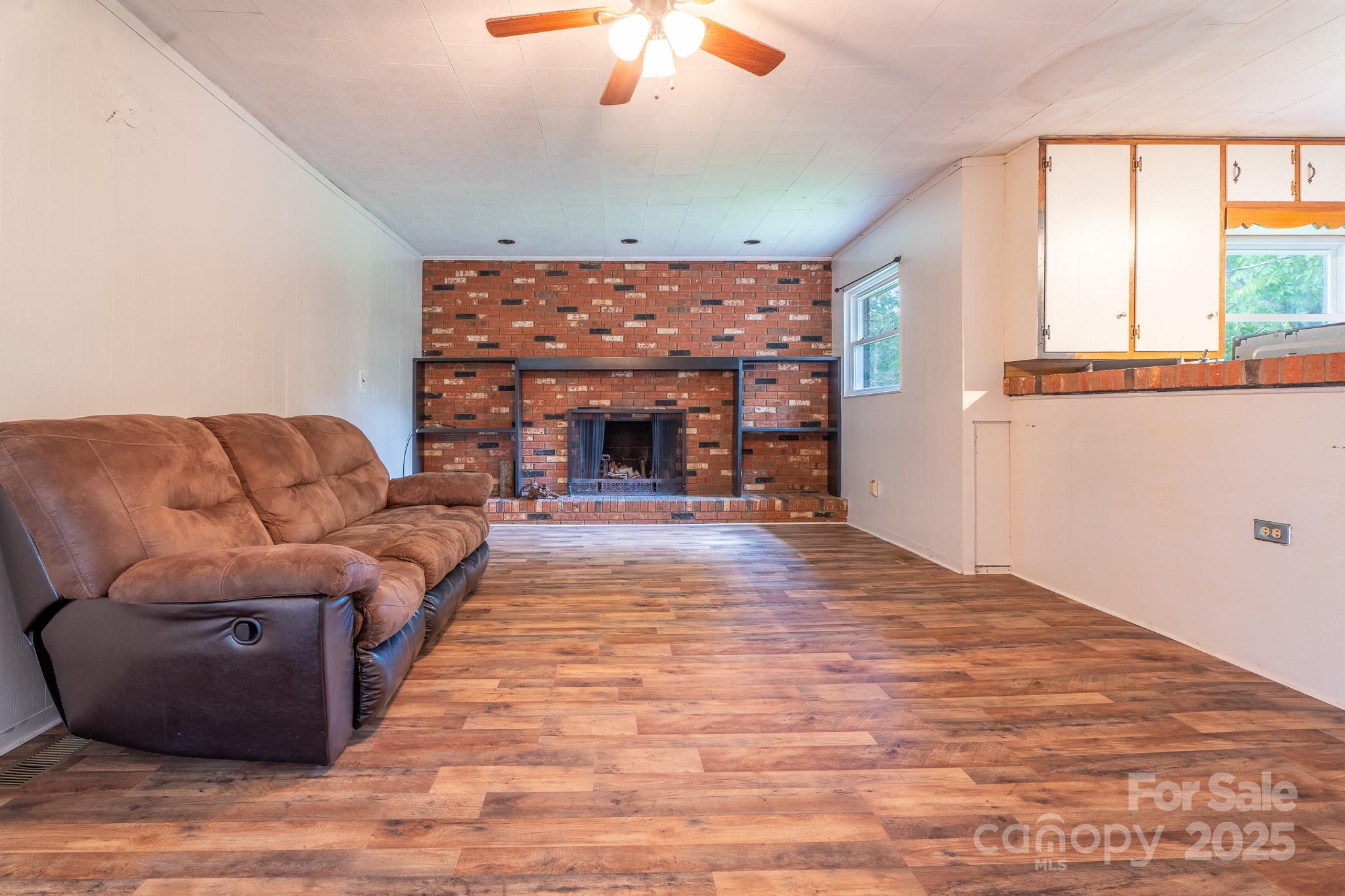 1851 Enon Road Valdese, NC 28690 - Photo 6 of 30 a living room with furniture and a fireplace