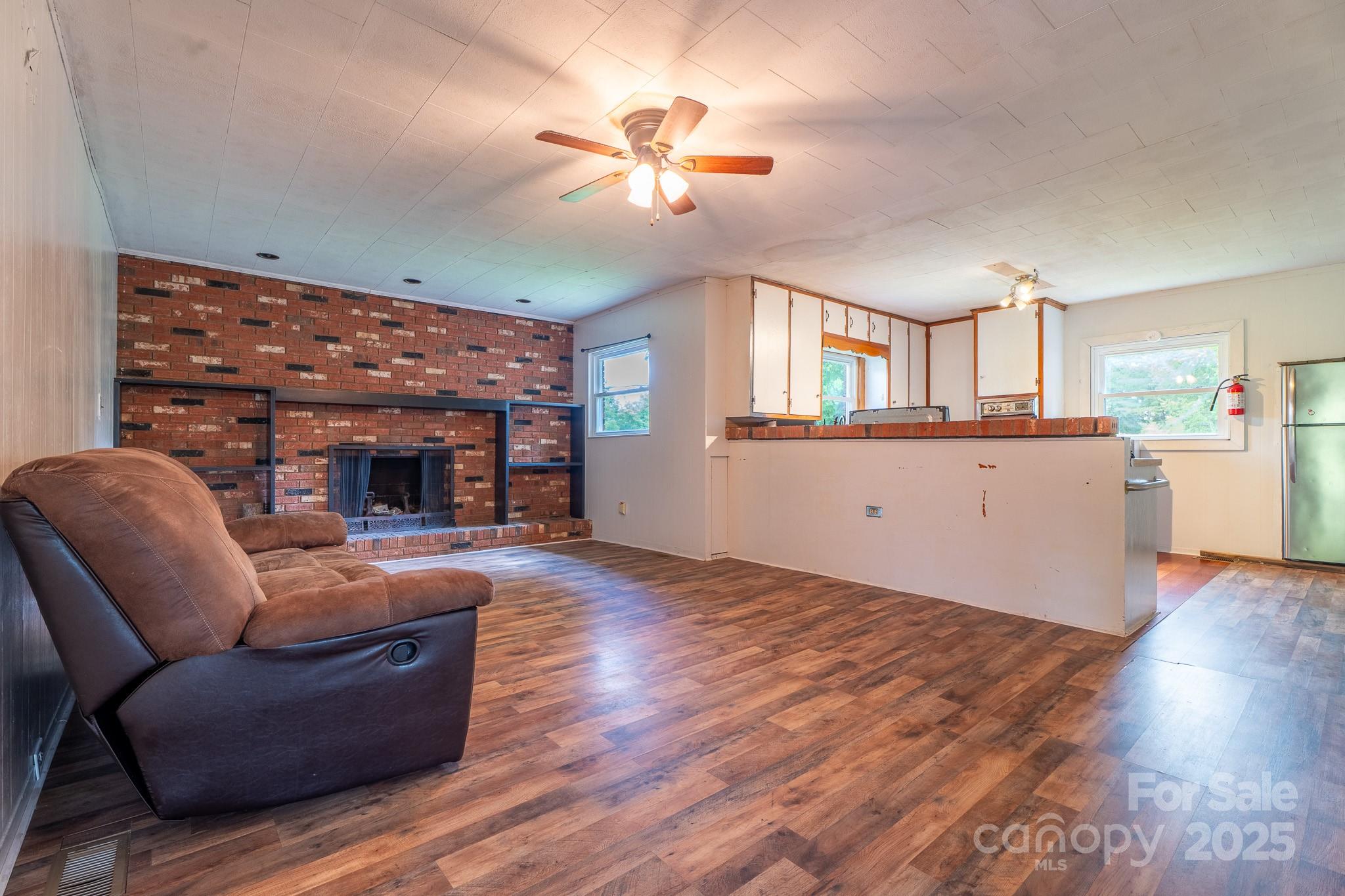 1851 Enon Road Valdese, NC 28690 - Photo 7 of 30 a living room with furniture and a fireplace