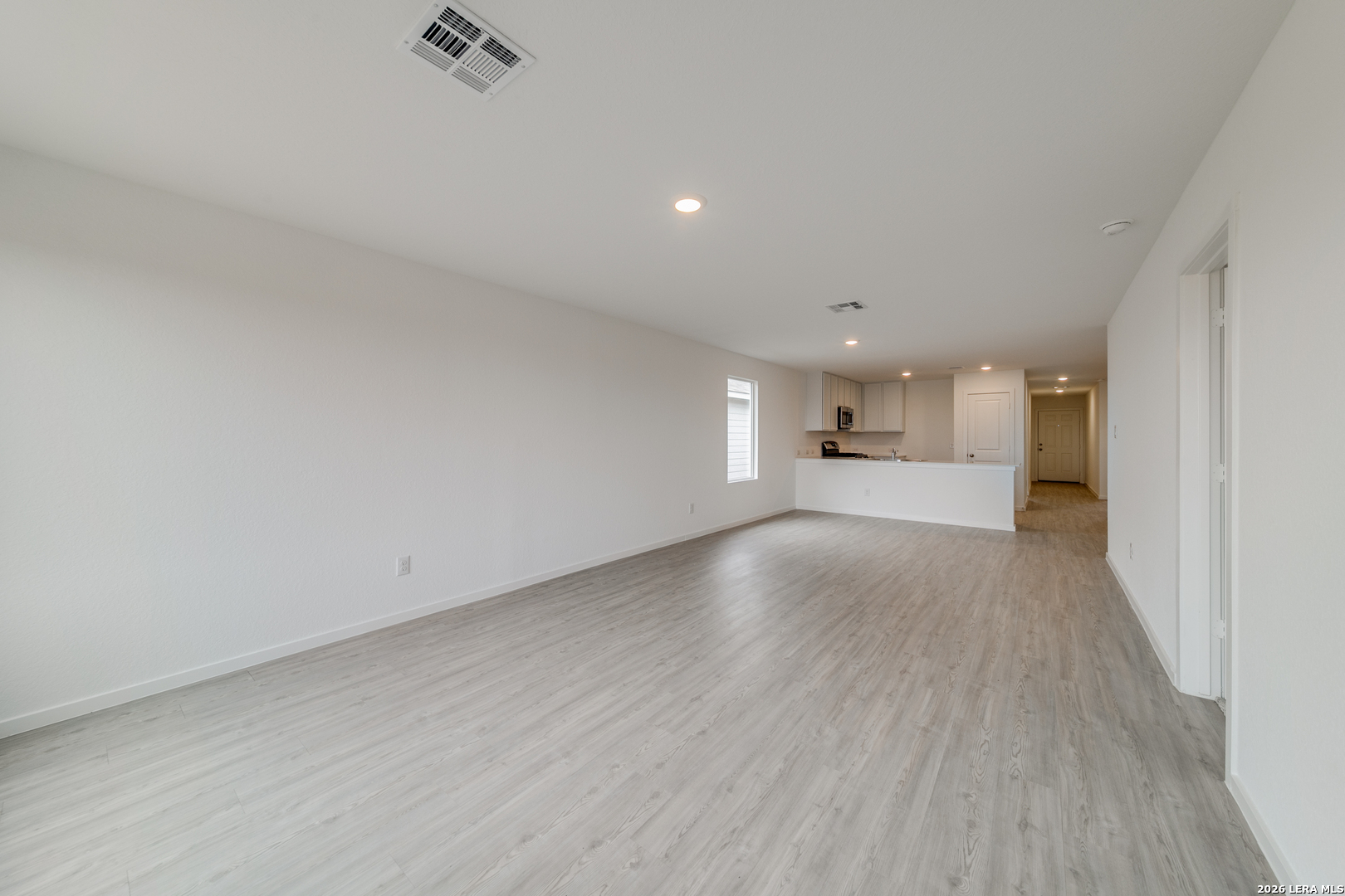 11621 Dog Rose Converse, TX 78109 - Photo 6 of 25 a view of empty room with wooden floor