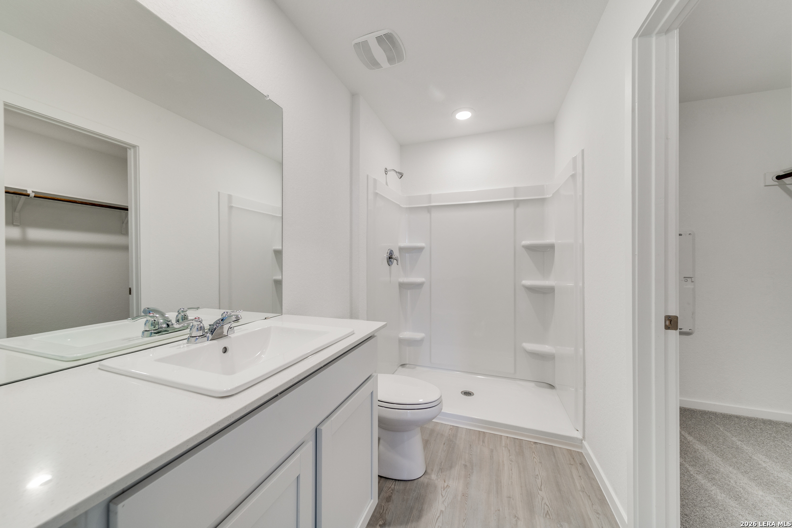 11621 Dog Rose Converse, TX 78109 - Photo 10 of 25 a bathroom with a sink a toilet and shower