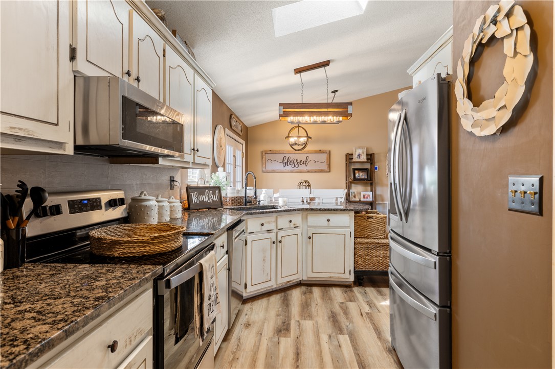 903 Huckleberry Lane Anderson, SC 29625 - Photo 15 of 42 This spacious kitchen offers ample granite counter space, stainless steel appliances, and a unique kitchen island.