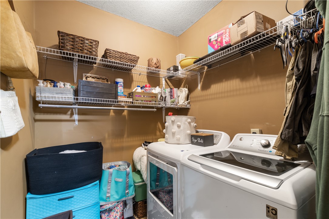 903 Huckleberry Lane Anderson, SC 29625 - Photo 18 of 42 This dedicated laundry space offers practical shelving for organized home management.