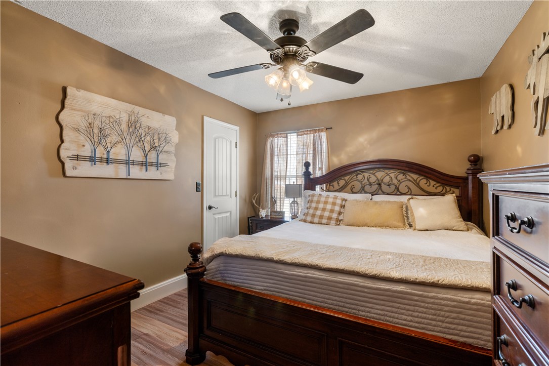 903 Huckleberry Lane Anderson, SC 29625 - Photo 19 of 42 This inviting bedroom features rich wood flooring and a refreshing ceiling fan.