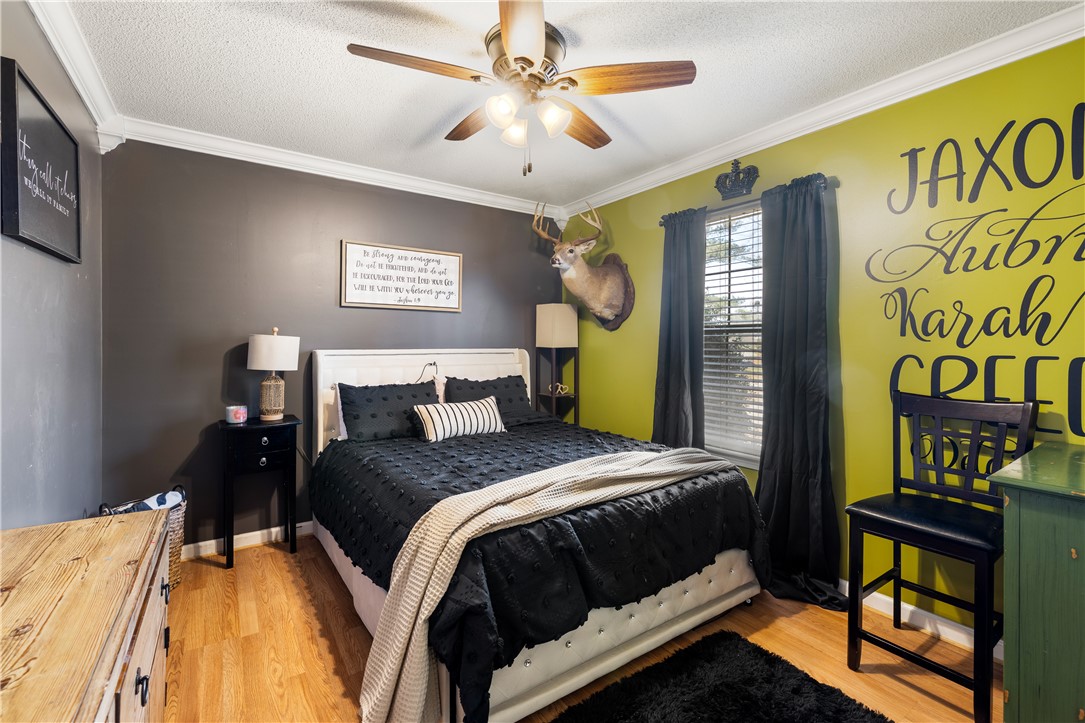 903 Huckleberry Lane Anderson, SC 29625 - Photo 22 of 42 This spacious bedroom features ample natural light and elegant hardwood flooring.
