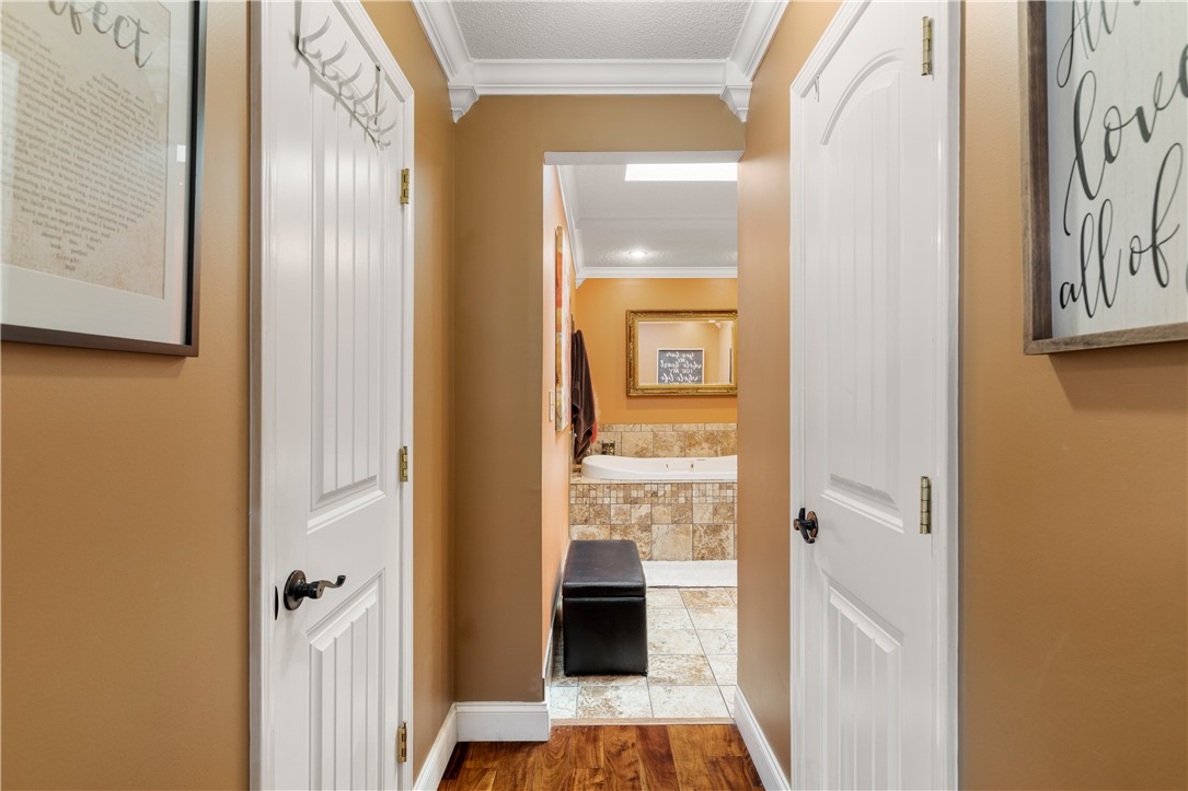 903 Huckleberry Lane Anderson, SC 29625 - Photo 26 of 42 This inviting hallway leads to a luxurious bathroom featuring a soothing soaking tub.