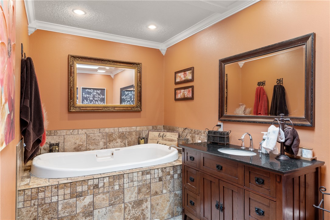 903 Huckleberry Lane Anderson, SC 29625 - Photo 28 of 42 This bathroom features a soaking tub, a double vanity, and tile flooring, perfect for daily routines.